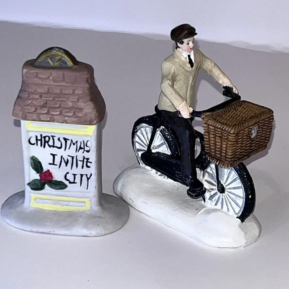 2 Christmas‎ Village Ceramic Figurines Man On Bicycle & Christmas In City Sign